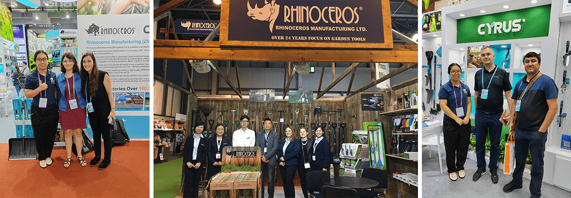 Large group of employees standing in front of the RHINOCEROS building